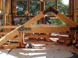 Cutsinger Custom Homes making a wooden structure.