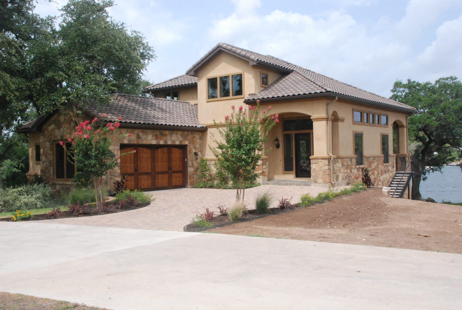 Stone house with a wooden garage door.